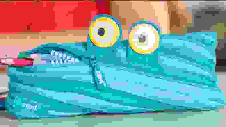 Blue monster-themed zipper pencil case.