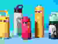 A few of the best water bottles for kids on a blue background.