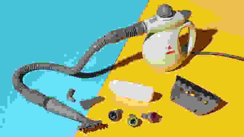 The Bissell Steam Shot Deluxe surrounded by its attachments against a blue and yellow background.