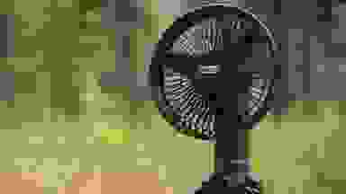 A portable fan being used outside.