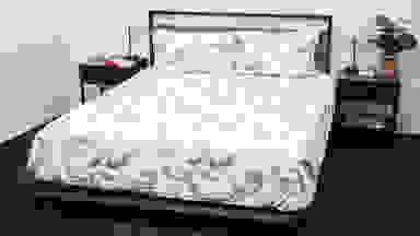 Bed made with floral flannel sheets