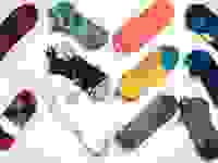 An array of unisex running socks from brands like Nike, Puma, and Saucony.