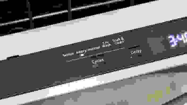 The top control panel of a dishwasher.