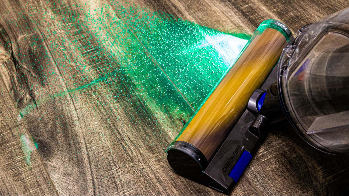 The Dyson Gen5outsize cleaning a hardwood floor with its Fluffy Optic head.