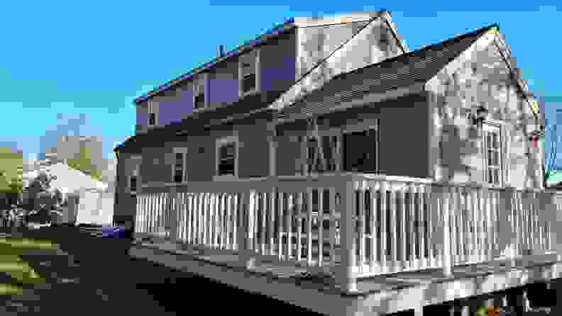 A ladder beside a gray house