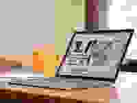 An open and powered on laptop displaying a website on its screen