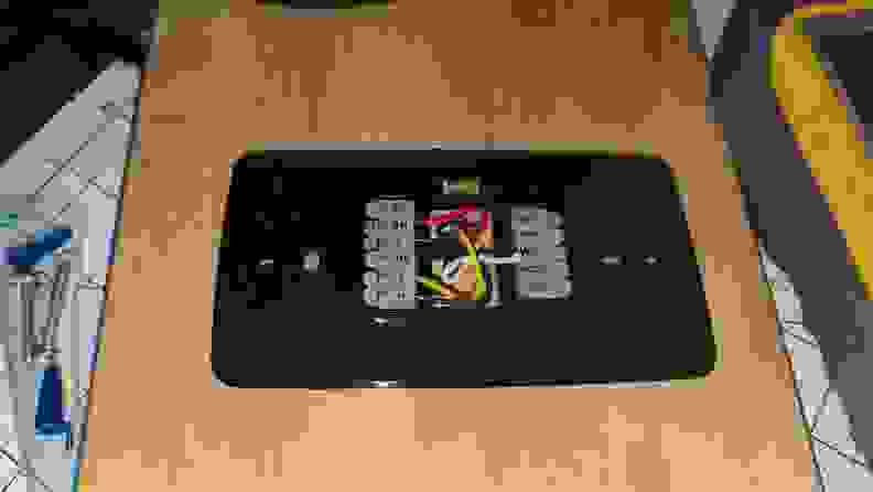 The image shows the thermostat wiring behind a Sensi Touch 2, including a C-wire.