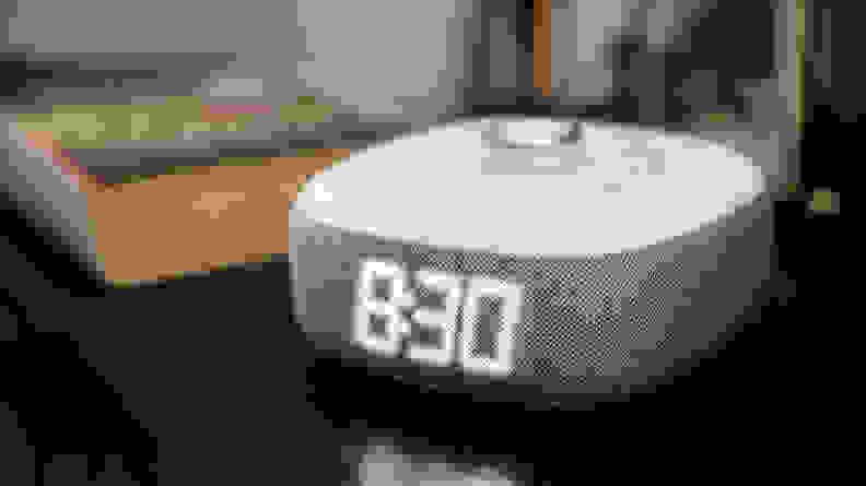 the sharp alarm on a bedside table with a work