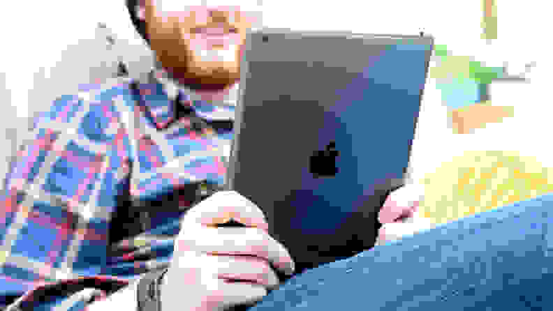 Man reading from a tablet