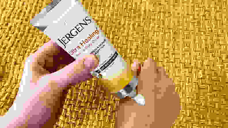 The author applying the Jergens Ultra Healing Hand & Body Cream to her right hand.