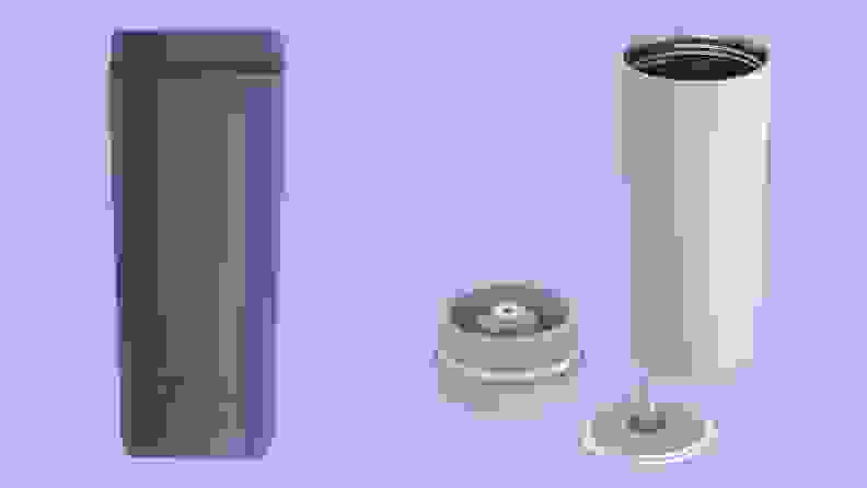 A blue travel mug and a white travel mug and lid on a purple background