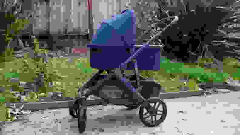 The Uppababy Vista V2 stroller with the canopy open, outside.