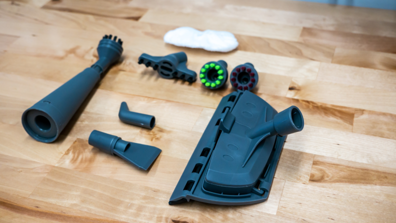 The attachment heads for the Bissell Steam Shot laid out on a table.
