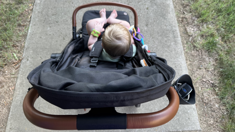 Baby sitting in the Bombi Bebee stroller