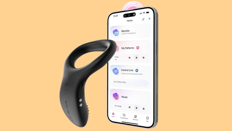 The Lovense Diamo sex toy next to a smartphone with the corresponding app on screen in front of an orange background.