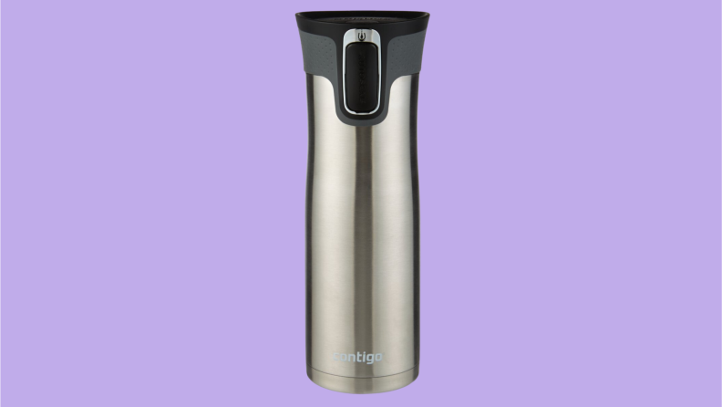 A silver travel mug on a purple background