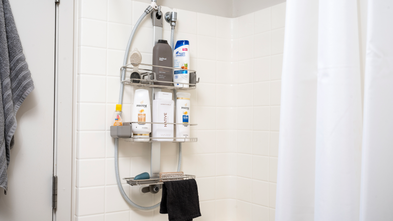 Simplehuman Adjustable Shower Caddy hangs in a tiled shower