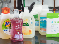 Eco-friendly laundry detergents sitting on top of a washer.