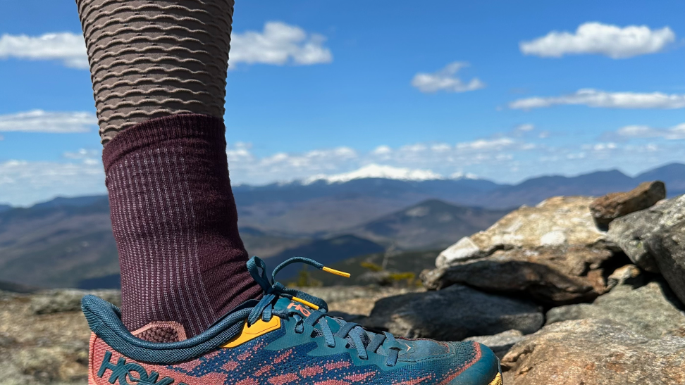 Staff Writer Lily Hartman wearing the Farm to Feet Damascus socks on Moat Mountain.