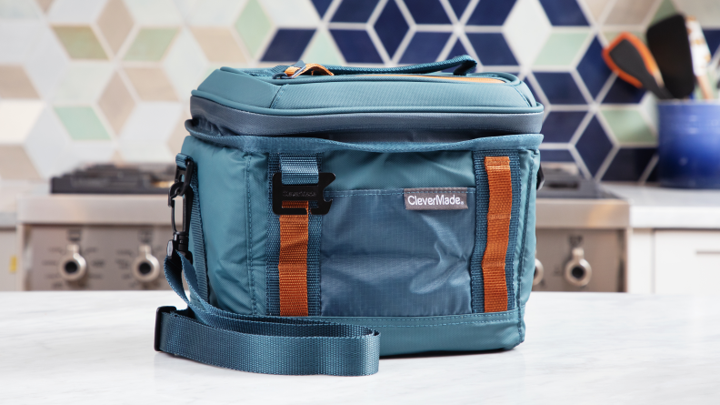 Blue CleverMade Pacifica Pro lunch bag on a kitchen counter.