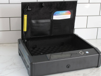 The Lockly Smart Safe with the lid open on a marble counter.