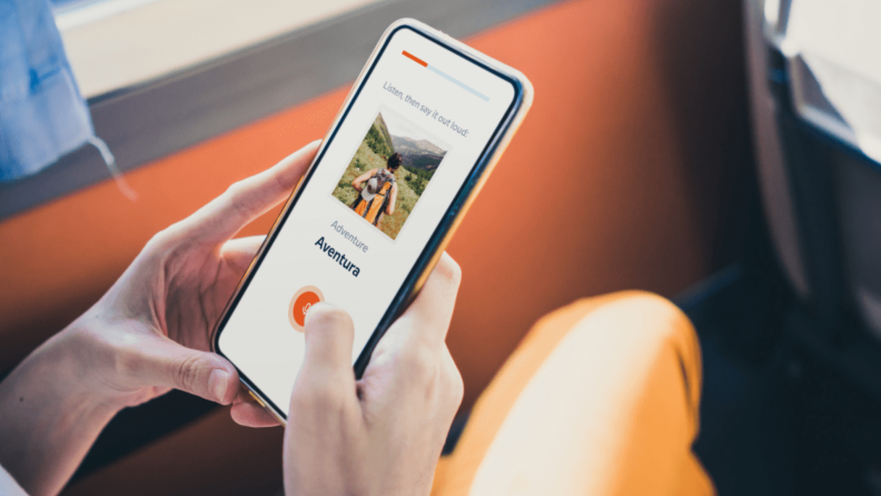 Phone with Babbel app open.