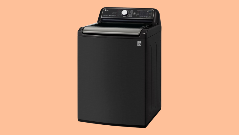 One of our best top-load washers, an LG WT7900HBA top-loading washing machine sits on a peach background.