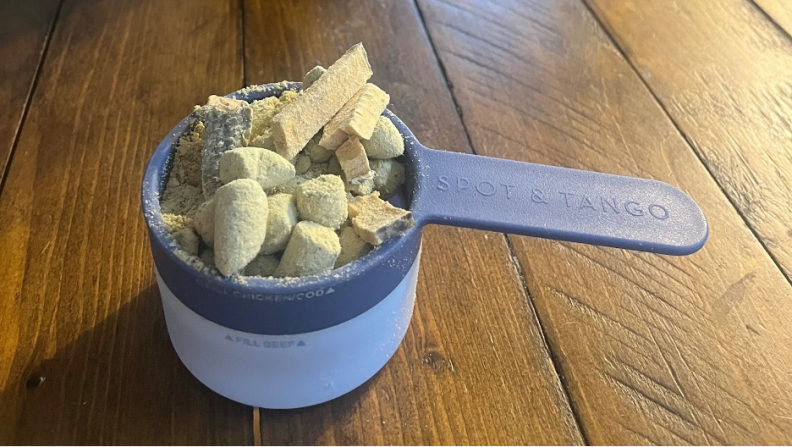 A scoop of pet food from spot and tango
