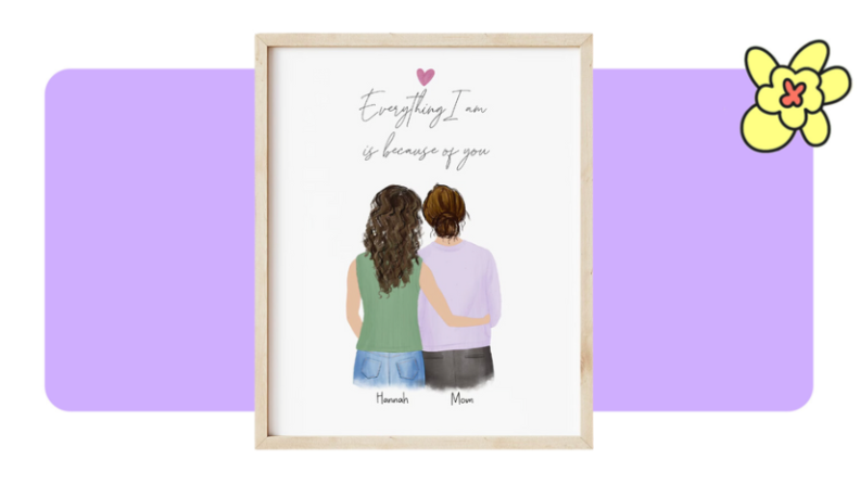 A printed photo of two people embracing inside of a wooden frame in front of purple background with a yellow flower in the corner.