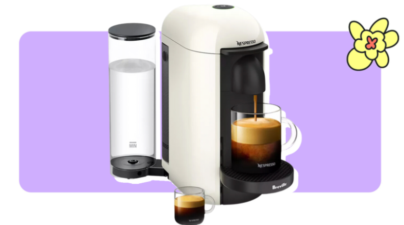 A white Nespresso VeruoPlus Single-Serve Coffee Maker that is brewing a cup of coffee in front of purple background with a yellow cartoon flower in the corner.