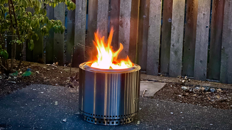 Open flame inside of Solo Stove Fire Pit 2.0 outdoors.