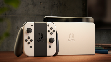 Close-up photo of the white-and-black Nintendo Switch OLED Model, one of the best consoles you can buy right now