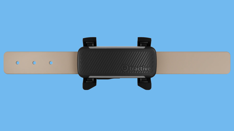 Tractive dog tracker collar on colored background